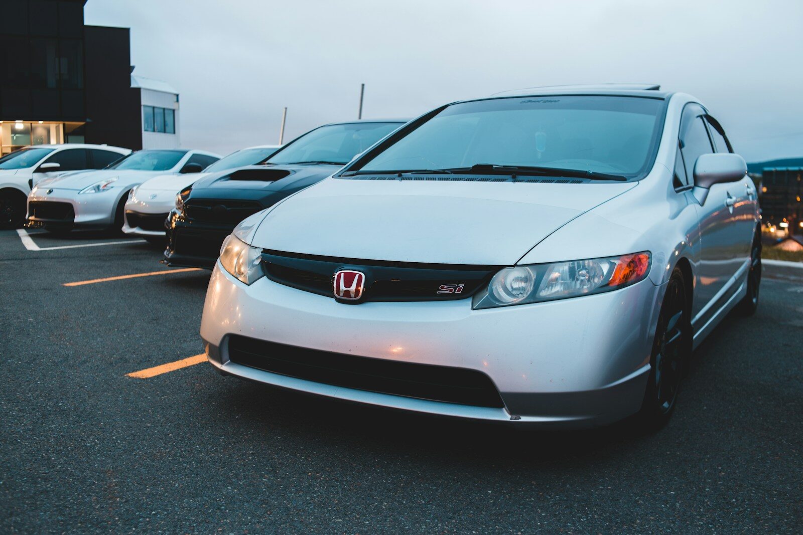 silver honda car on parking lot during daytime